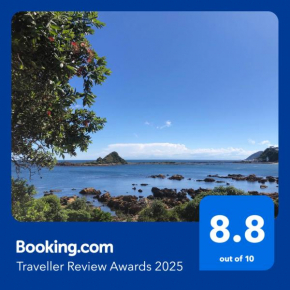 Seafront Haven in Island Bay with Deck, Outdoor Bath, and Parking
